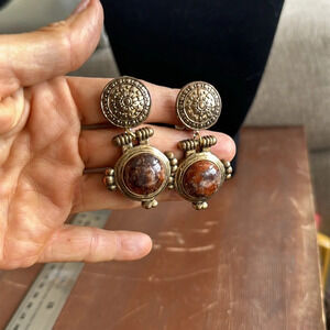 Gold clip on earrings with some sort of gemstone